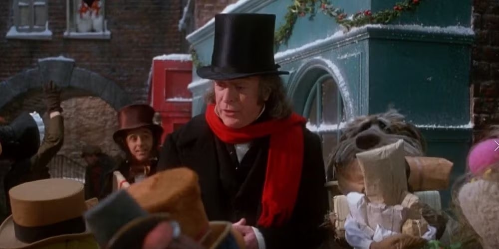 scrooge in street in muppet christmas carol with sprocket