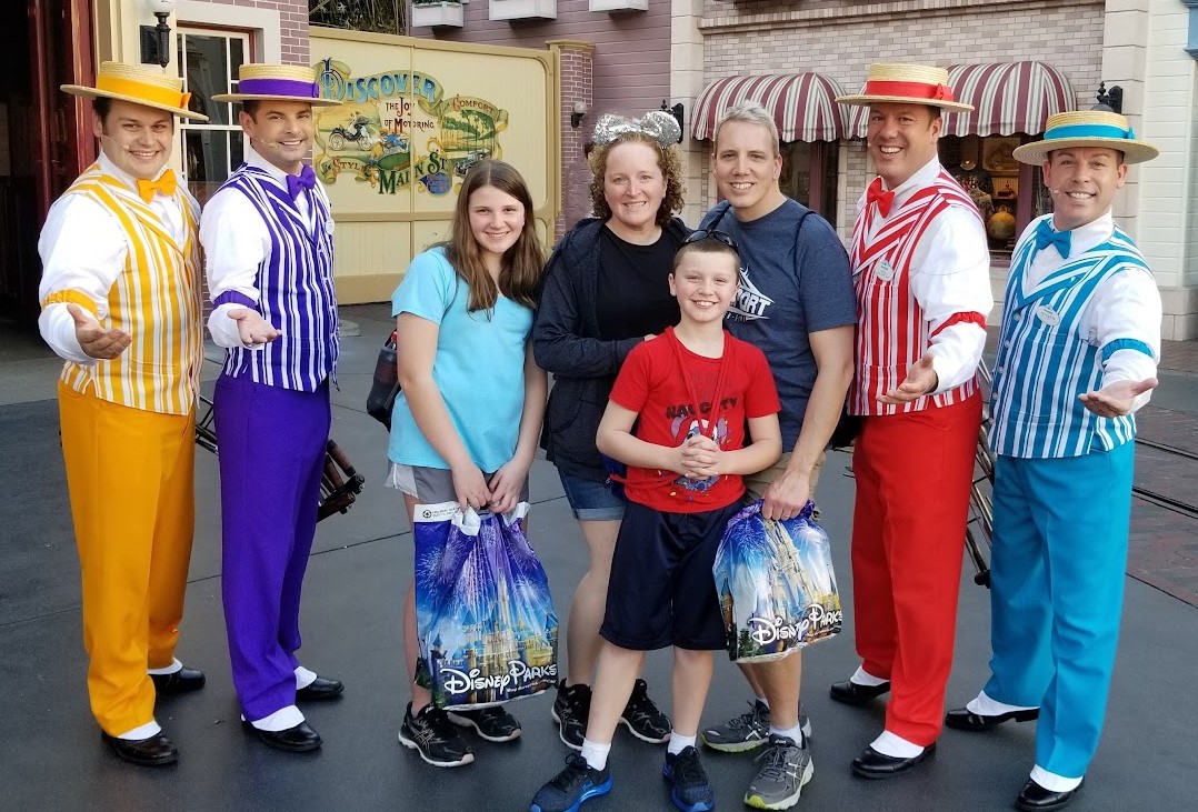 smith family with dapper dans in disneyland