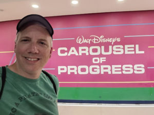 jim smith in front of carousel of progress wall