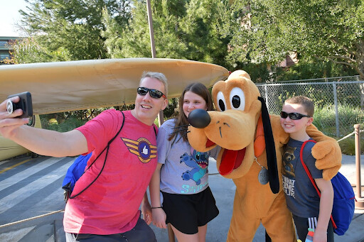 smith family with pluto in disney california adventure